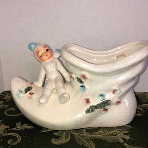 Vintage pixie planter on top of boot